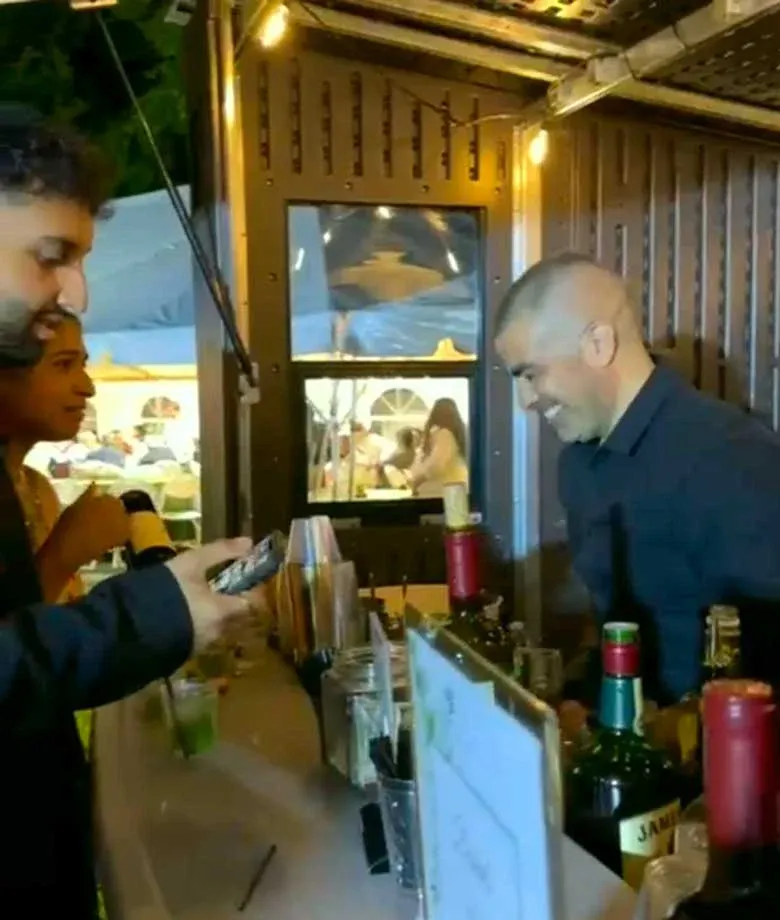 Miguel Master Bartender smiling preparing cocktail in a backyard party in NJ