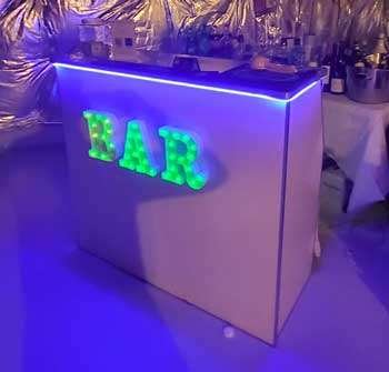 a portable bar with a BAR sign at bartenders vip mix event
